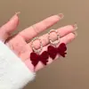 Pendientes rojos de Año Nuevo para mujer, otoño e invierno, con lazo, con clip para las orejas, nuevos pendientes de perla de Año Nuevo 2024