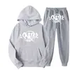 Conjunto de Marca Tendência da Moda de Rua Synaword para Homens e Mulheres, Moletom com Capuz Hip-Hop Tendência do Instagram, Moletom Estampado Syna Venda Quente