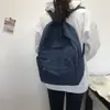 Mochila escolar de lona retrô para estudantes estilo ins feminina mochila versátil para estudantes do ensino médio feminino cor sólida simples mochila de campus masculina