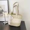 Bolso de Paja Tejida para Mujer Estilo Francés con Adorno de Encaje 2026 Nuevo Verano para Salir a la Playa Estilo Ins Bolso de Hombro Único Tipo Cubo