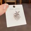 Super flash full diamond meteoro agujero de oreja clip de hueso de oreja diseño de moda nicho femenino alta sensación aretes de viento frío al por mayor