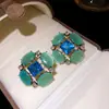 Pendientes vintage de plata con pasador y piedra ojo de gato incrustada de diamantes, pendientes de estilo palacio retro, sensación de lujo ligero y alta gama, pendientes para mujer