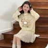 Conjunto de Ropa de Verano para Niñas 2026 Nueva Camiseta Rayada de Seda Helada Protectora del Sol y Conjunto de Falda de Dos Piezas de Moda para Niños