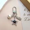 Nuevo de Moda Venta Caliente Transfronteriza Estilo Coreano Flor de Cinco Pétalos Niña Flor de Pera Colgante Llavero Accesorio Decoración para Bolsa Zouju