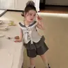 Conjunto de Top e Shorts Feminino Estilo Coreano 2026 Chegada de Verão Gola Azul Marinho Laço Doce Versátil Tendência