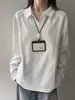 Camisa polo de manga larga tipo patchwork estilo americano en gris claro para hombre, silueta de otoño, corte de hombro regular, adecuada como capa interior o capa base, con cuello de solapa