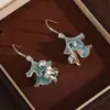 2026 Nuevos Pendientes de Gancho con Hojas de Ginkgo de Venta Caliente Moda de Gama Alta Dulce Fresco Temperamento Pendientes de Botón Pendientes de Lujo Ligero de Nicho Accesorios