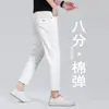 Jeans de hombre elásticos blancos Xintang de Guangzhou, largo 7/8 o 9/8, marca de alta gama moderna, adecuados para personas de 160 cm de altura