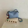 Elegante y chic bolso de mano tipo dumpling para mujer, nuevo modelo otoño e invierno 2026, patchwork de estampado de leopardo de lujo ligero para uso diario, bolso de hombro y cruzado