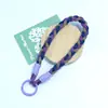 Lanyard para teléfono Huayang personalizable de dos tonos tejido a mano, correa de muñeca trenzada anti-pérdida, cadena colgante portátil para botella de agua