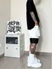 Basquete Americano Esportes Shorts Masculino Verão Preto e Branco Costura Design Sense Calças Retas Joelho-comprimento Macacão