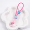 Cordón para Teléfono Móvil Nudo de Diamante Corto Cara Sonriente Combinación de Colores Cordón Trenzado Anudado Llavero de Felpa Accesorios de Correa Anti-Pérdida