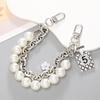 Yilian novo estilo Chanel Pérola cadeia portátil dupla cadeia pulseira pulseira caixa de telefone chaveiro-cadeia resistente a quedas atacado