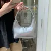 Nova Bolsa de Ombro de Prata em Formato de Meia-Lua para Primavera e Verão para Mulheres, Bolsa de Mão de Ombro Versátil da Moda Estilo Francês