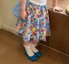 Conjunto Súper Estiloso de Niña Estilo Coreano Verano 2026 Nuevo Modelo, Moda de Top con Estampado de Manga Corta y Falda Floral de Moda para Niñas Pequeñas