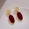 Pendientes geométricos irregulares únicos diseño nicho pendientes retro estilo Hong Kong pendientes colgantes femeninos esmalte rojo vino