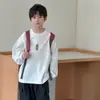 Camiseta Blanca de Manga Larga para Niños Estilo Nuevo Primavera/Otoño 2026 para Niños Medianos y Grandes Ropa Infantil Top de Capa Base
