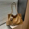 Bolso tote minimalista de nicho Shuai Mi Jia para mujer, nuevo modelo otoño 2026, de gran capacidad, casual, para ir al trabajo, de hombro y debajo del brazo