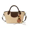 Bolsa de mão de alto valor feminina 2026 nova simples elegante bolsa quadrada pequena de mão nicho personalidade chique bolsa de ombro única transversal