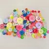 Botones de resina mixta de color spot al por mayor calcomanía de botón para jardín de infantes flor de botón bolsa de materiales hechos a mano DIY