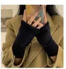 Guantes sin dedos de punto a la moda para mujer Versátiles de medio dedo Cálidos Otoño e Invierno Calcetines de mano Estudiante Color sólido Guantes de felpa