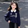 Conjunto de Dos Piezas para Niñas Estilo Academia 2026 Primavera/Otoño Moda Versátil Sudadera con Capucha Cuadros Patchwork Pantalones de Pierna Ancha