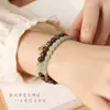 Pulsera de Doble Círculo de Madera de Águila Verde y Jade Hetian con Colgante de Paz de Oro Arena y Accesorios de Calabaza de Jade Hetian