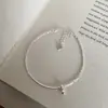 Plata pura S925 con piezas de plata dispersas, pulsera de tubo curvo con campanilla pequeña para mujer, estilo nicho versátil simple y delgado, nuevo accesorio brillante
