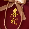 Bolsas de mano con relieve dorado para regalos de boda, bolsas de regalo, bolsas de recuerdo, bolsas de embalaje para regalos de boda al por mayor