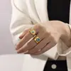 Anillo Tyna French de Oro de 18K Turquesa Acero Inoxidable para Mujer Apertura Cruzada de Alto Nivel Flor de Acero de Titanio