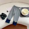 Em estoque QK262896 Calça infantil forrada com fleece 2026 outono estrela laço cor contrastante legging com punho