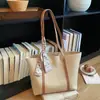 Bolso grande para mujer 2026 nuevo bolso de hombro de moda primavera-verano, bolso tote de nicho de gran capacidad para la escuela y el trabajo