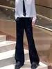 Pantalones negros ligeramente acampanados para hombre, nueva colección de otoño, estilo coreano, diseño único con un patrón de cielo estrellado y salpicaduras de tinta, creando un look sofisticado y casual