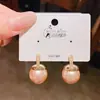 Pendientes versátiles de temperamento para el día a día con colgante de perla grande para mujer, lujo ligero, nicho, alta gama, exquisitos, con incrustaciones de diamantes, joyería para orejas