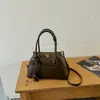 Bolsa tipo caparazón de bolos para mujer, estilo nicho retro simple, bolsa de hombro y axila, adecuada para ir al trabajo y viajar, bolso cruzado