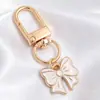 Colgantes de dibujos animados rosas lindos estilo coreano, dijes de aleación de esmalte de conejo y estrella, llaveros con anilla en D, accesorios para manualidades, venta al por mayor