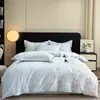 Juego de cama de lujo y elegante de cuatro piezas 100% algodón de fibra larga de Xinjiang, hecho completamente de algodón puro, con diseños florales y bordados de alta gama, adecuado para madres y bebés