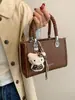 Bolsa quadrada pequena minimalista da moda transfronteiriça para mulheres, nova bolsa de ombro 2026, bolsa transversal versátil para o dia a dia, estilo popular