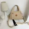 Moda Transfronteriza casual retro bolso mujer casual todo-partido bolso de hombro para mujer gran capacidad multibolsillo color liso bandolera