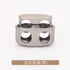 Hebilla elástica de cordón de metal cilíndrica de dos agujeros con forma de mina terrestre, hebilla de resorte T5325