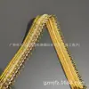 Venta directa de fábrica: Ribete de encaje con hilo dorado de 2.5CM, adecuado para mercados nacionales e internacionales, utilizado como accesorio de prenda para vestidos, faldas y otras prendas de vestir