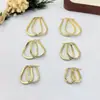 Pendientes de acero inoxidable de venta caliente transfronteriza, temperamento fresco, corazón de aleación, tachuelas, diseño de nicho, sentido de alta gama, pendientes de lujo ligero