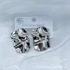 Novos Brincos de Tarraxa Geométricos Irregulares Retrô Transfronteiriços para Mulheres Simples Versátil Criativo Aço Titânio Design Hidráulico Joias no Atacado