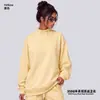 Conjunto de ropa europea y americana para mujer transfronterizo: sudadera casual y shorts, sudadera holgada de forro polar color liso, cuello medio alto, estilo 'dopamine hot girl'