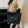 Bolsa de Mão de Grande Capacidade com Design de Nicho Feminina Outono/Inverno 2025 Nova Bolsa de Mão Casual Versátil Bolsa Tote para o Trabalho
