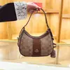Comercio Exterior Venta Caliente Bolso de Mujer 2026 Nuevo Bolso de Media Luna de Moda Tendencia Bajo el Brazo Versátil Bolso de Mano de un Solo Hombro Bolso Cruzado para Viajes