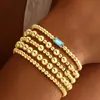 Pulseira de Contas Douradas com 12 Pedras de Nascimento Estilo Europeu e Americano Transfronteiriço Conjunto Simples de Pulseiras Douradas Multicamadas com Cordão Elástico Presente de Aniversário para Mulheres