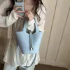 Bolso tipo cubo texturizado estilo western 2026 versión coreana verano nueva moda simple casual versátil bolso de hombro cruzado