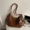 Nueva mochila retro 2026 para mujer, colección otoño/invierno, con un diseño lindo y elegante, gran capacidad, bolso de hombro casual y un bolso tote moderno y minimalista