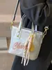 Venta al por mayor popular nicho personalidad impresión de letras bolsa de cubo portátil moda alta textura bandolera para ir al trabajo mujeres